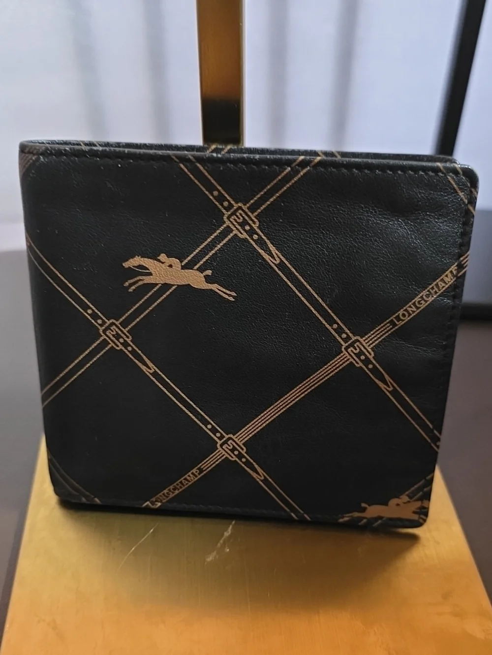 Longchamp Black and Gold Printed Leather Wallet